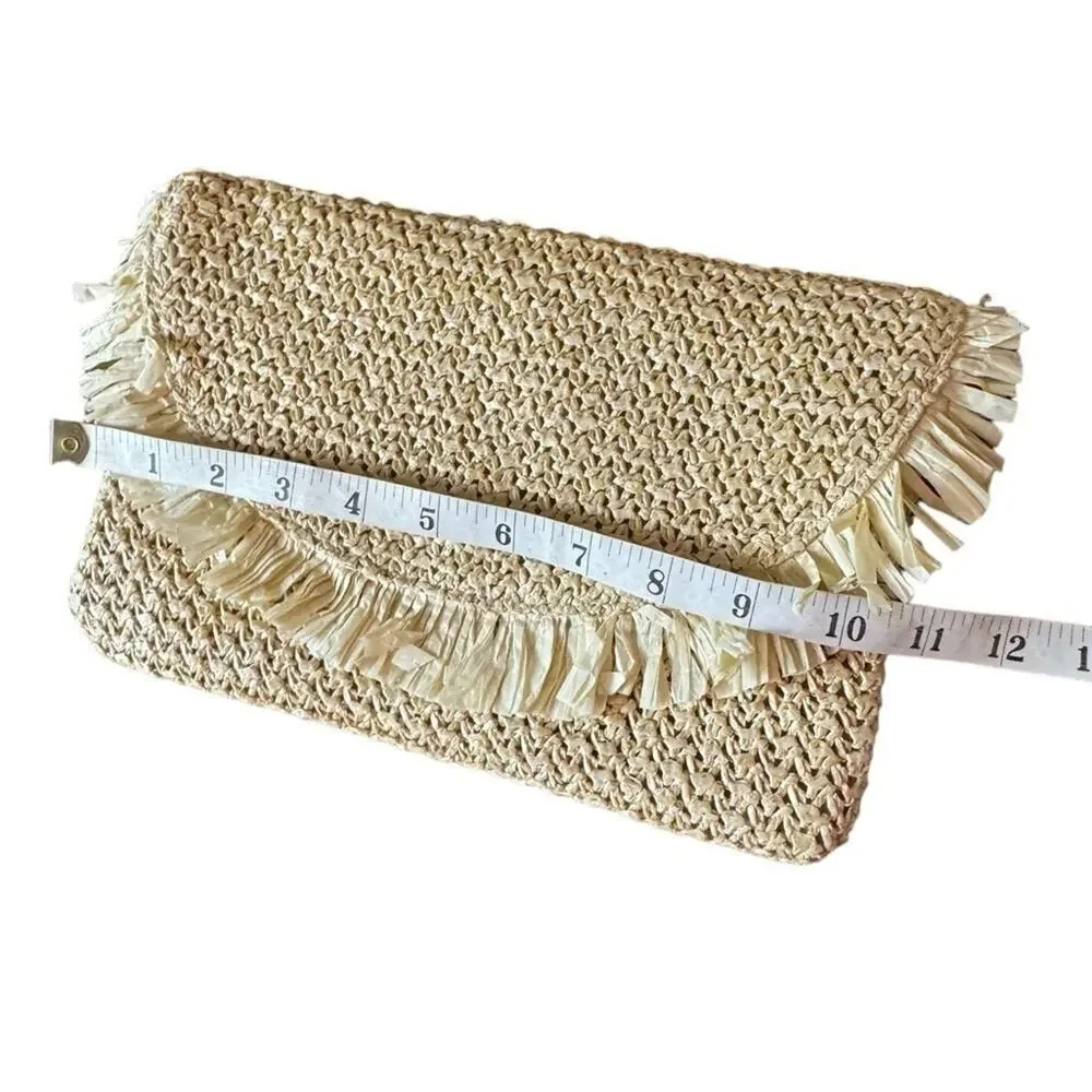 The North Shore Natural Frayed Tassel Clutch